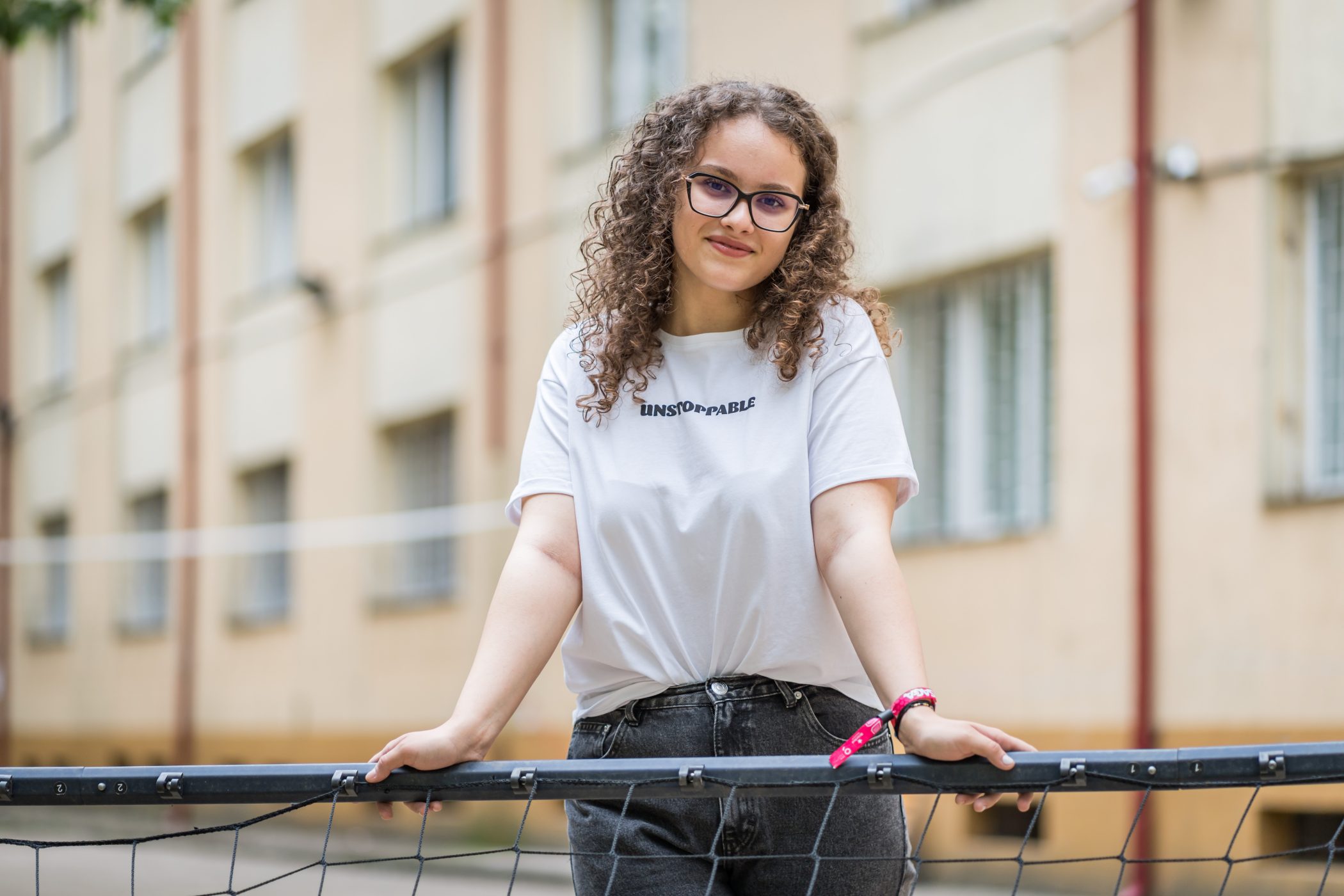 A teenager wearing a toolkit T-shirt